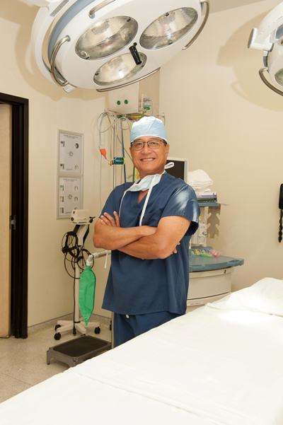 board-certified plastic surgeon Dr. Paul Kim in the operating room at Legacy Plastic Surgery